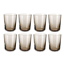 Set of eight Scandinavian minimalist smoked glass water glasses with a classic cylindrical shape and subtle brown tint.