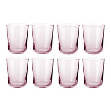 Set of eight clear pink tinted water glasses with Scandinavian minimal design and cylindrical shape.