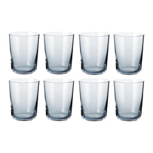 Set of eight clear Scandinavian design water glasses with a classic cylindrical shape and minimalist finish.